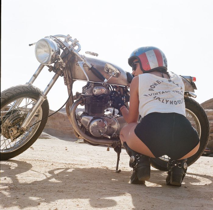 A playful frame from Girls on a motorcycle — online in Minsk
